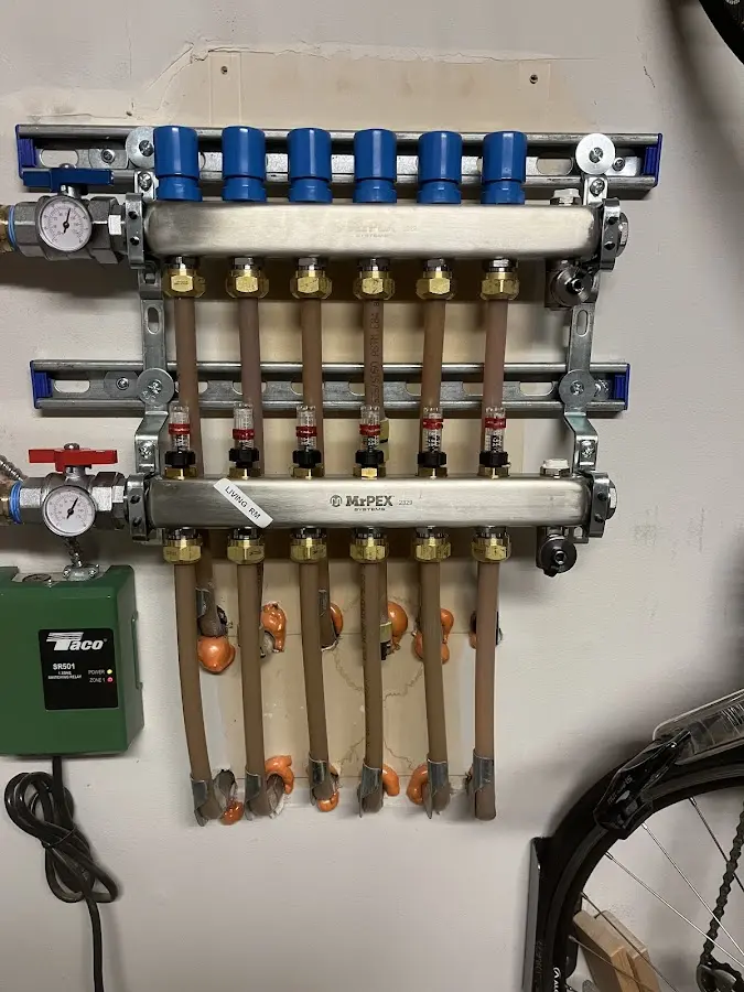 Plumber performing Water Heater Repair at a residential property in Allegan